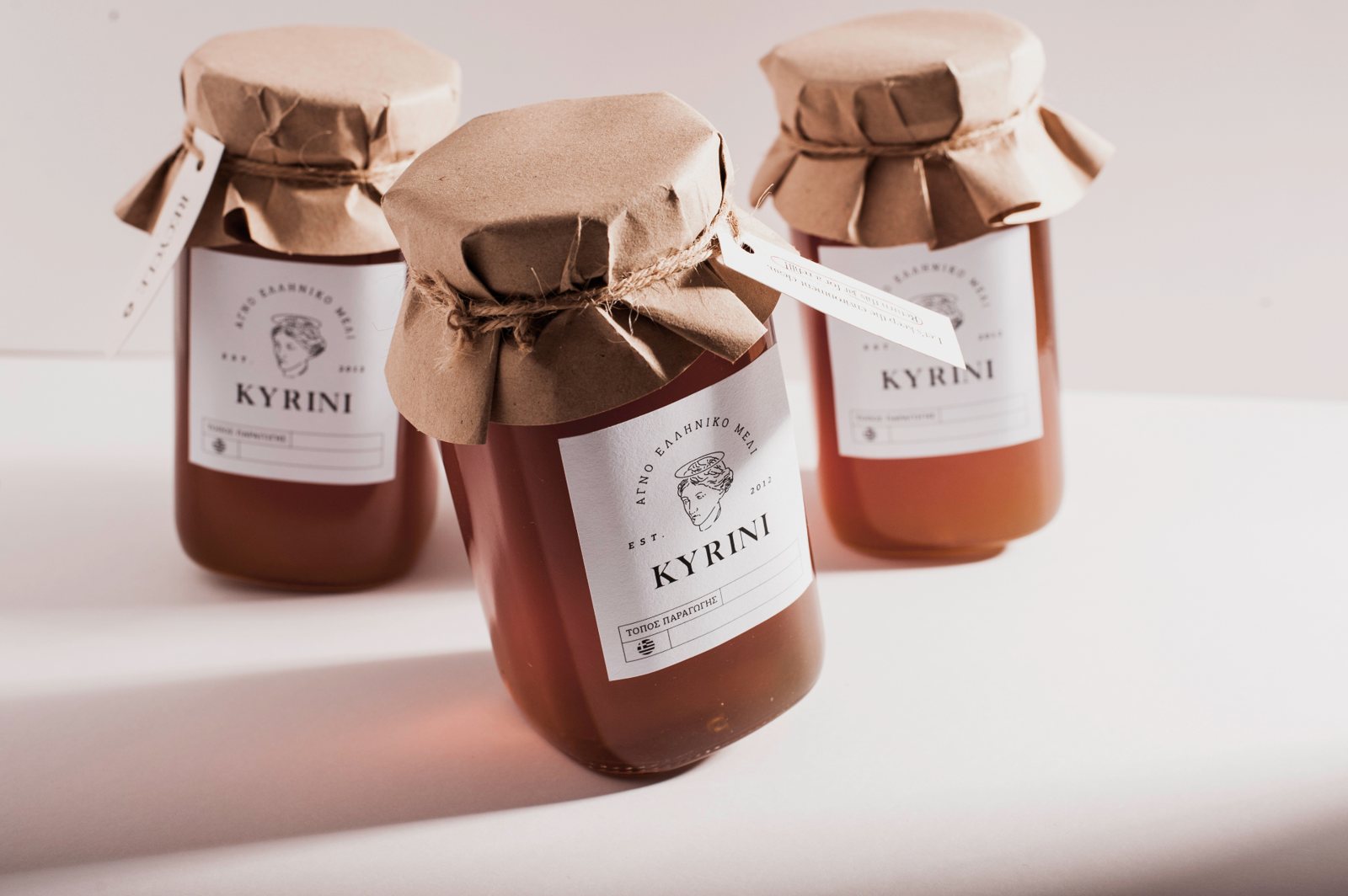 KYRINI honey jar with paper cover and packaging