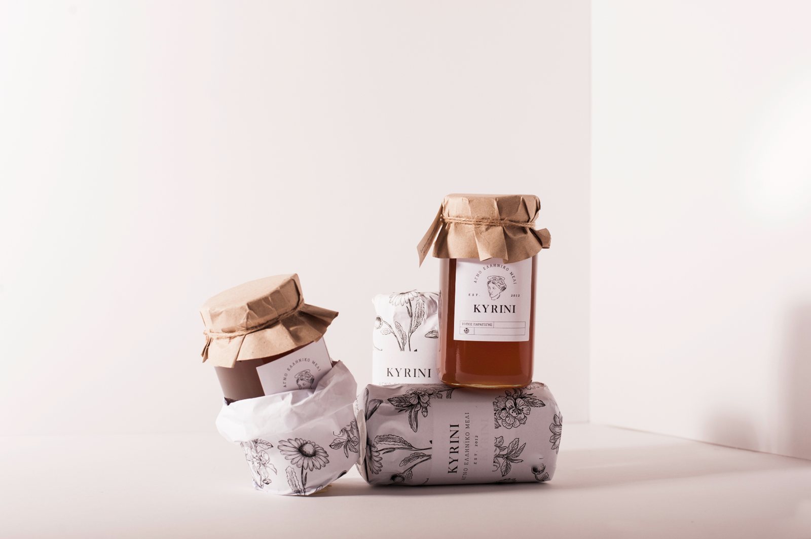 KYRINI honey jar with paper cover and packaging